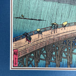 Load image into Gallery viewer, Small Framed Woodblock Print (Bridge in the Shower )

