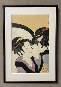 "A Beautiful Woman Looking in a Mirror" (Printed by  Nagao)
